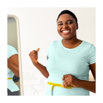 Image of a person measuring their waist
